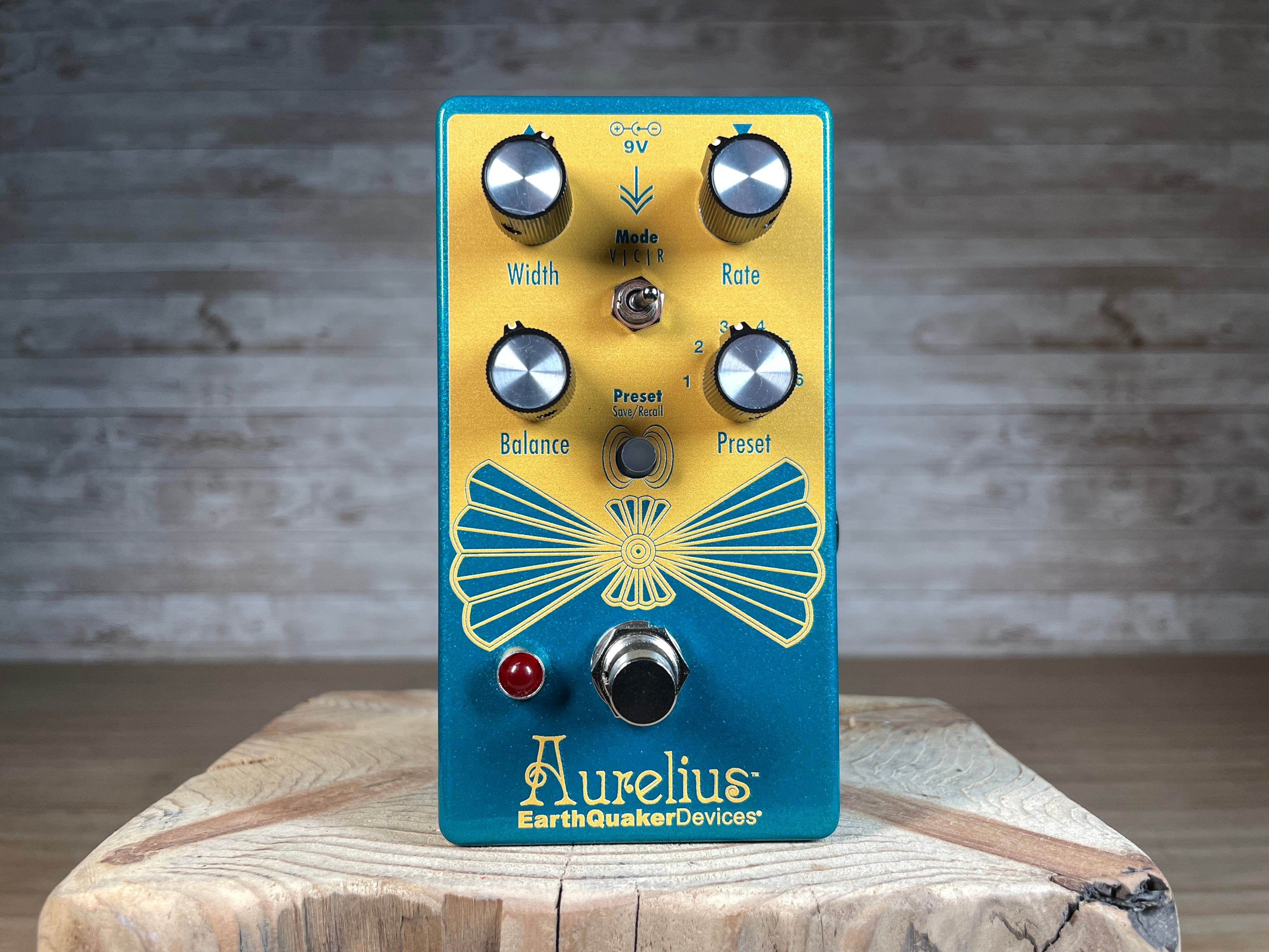 Blue and yellow EarthQuaker Devices Aurelius guitar effects pedal with four control knobs, toggle switch, and footswitch.