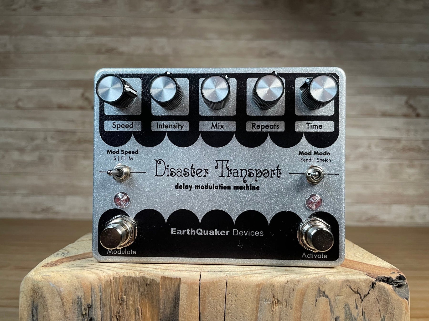 Silver EarthQuaker Devices Disaster Transport modulation guitar pedal with five knobs, two toggle switches, and two footswitches.