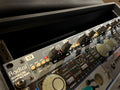 Close-up photo of Radial Space Heater tube mixer with multiple knobs, buttons, and LED indicators in a rack unit.