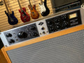 Front panel of a Universal Audio 6176 audio processor with knobs, switches, and a VU meter.