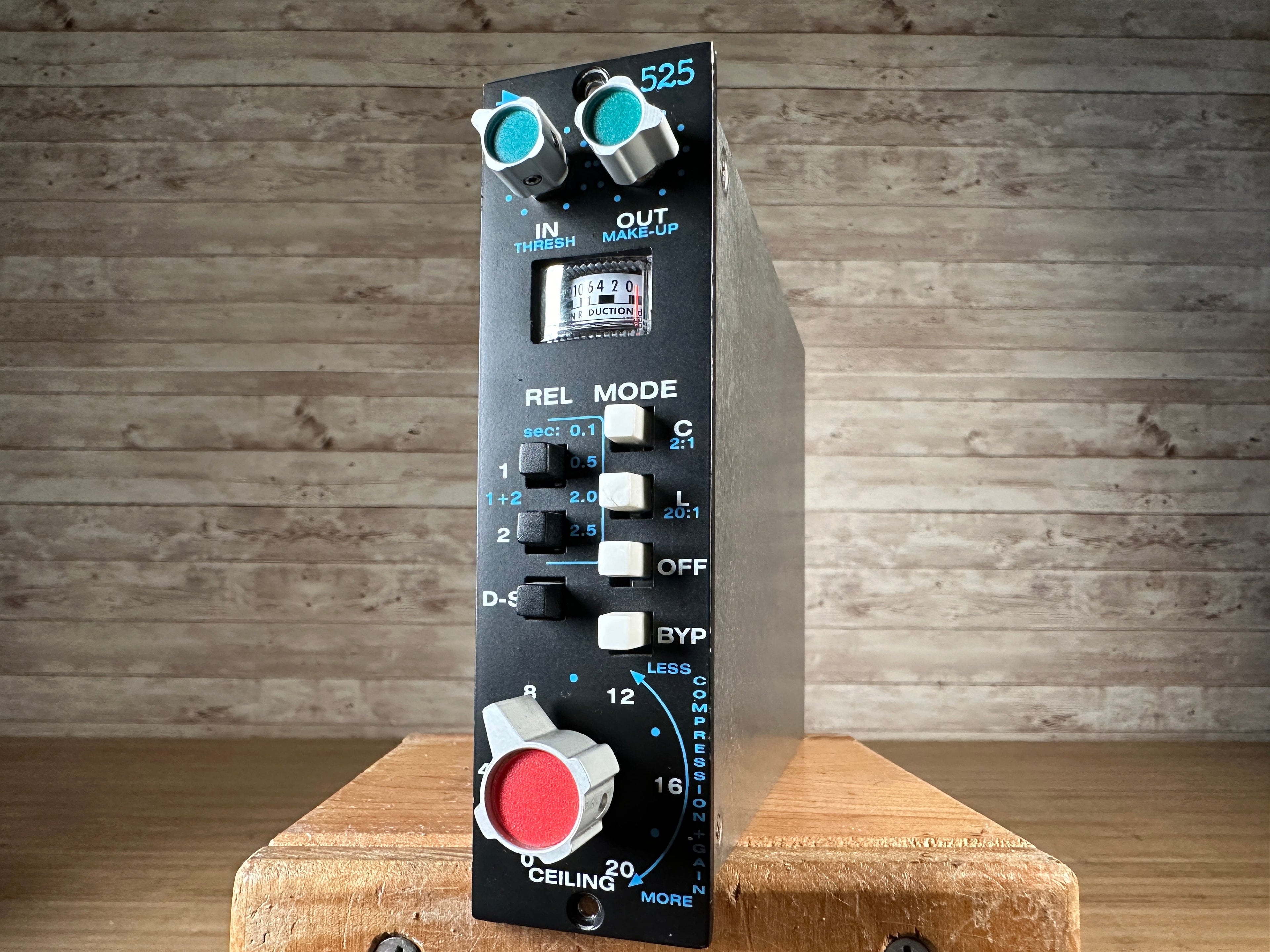 Black studio rack unit with various knobs and switches labeled 525 and compression gain settings