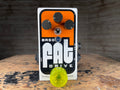 White and orange guitar effects pedal with three knobs, toggle switch, and blue LED on a wooden surface.