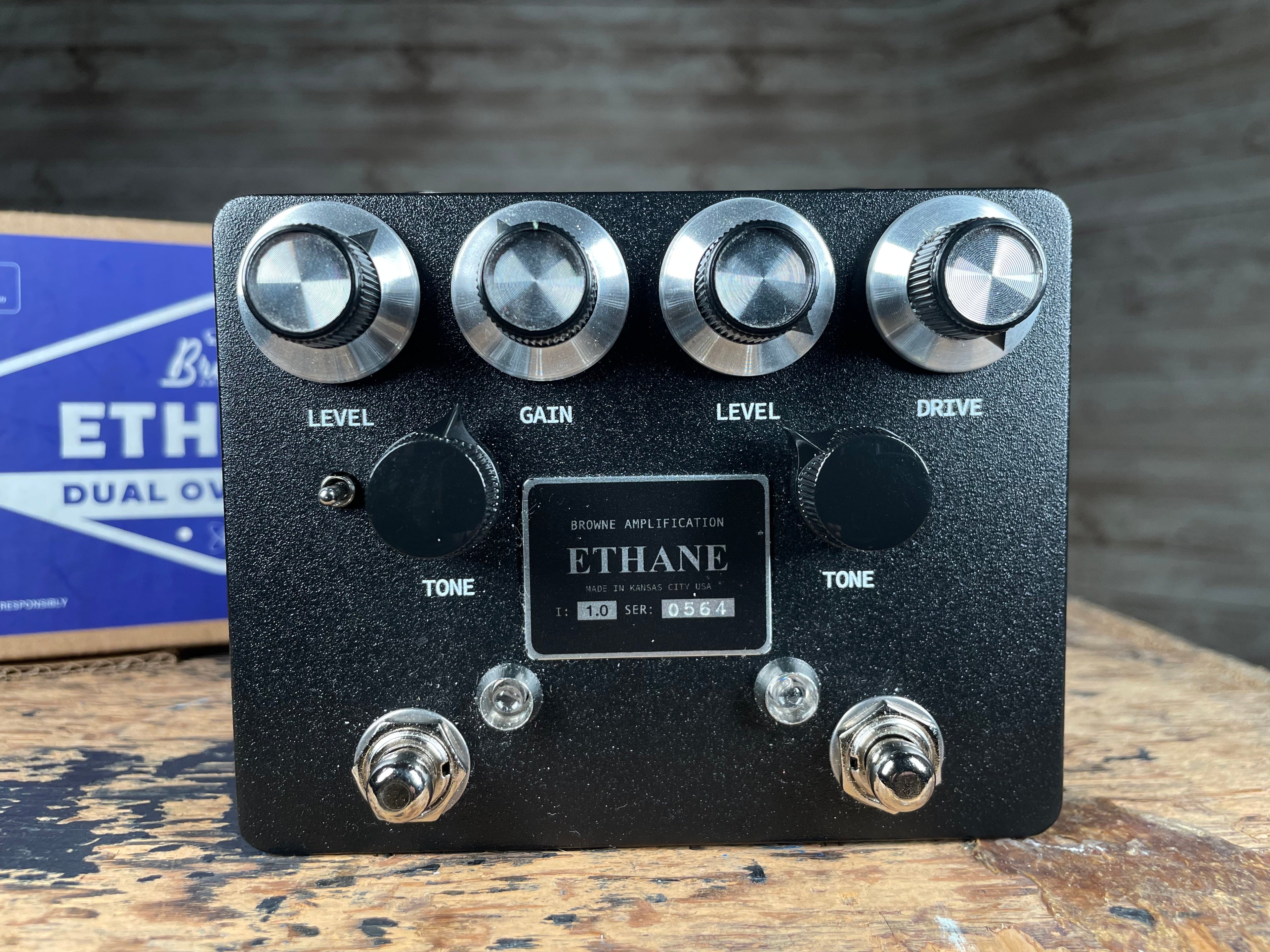 Black Browne Amplification Ethane dual overdrive pedal with knobs, switches, and label, with blue box in background.