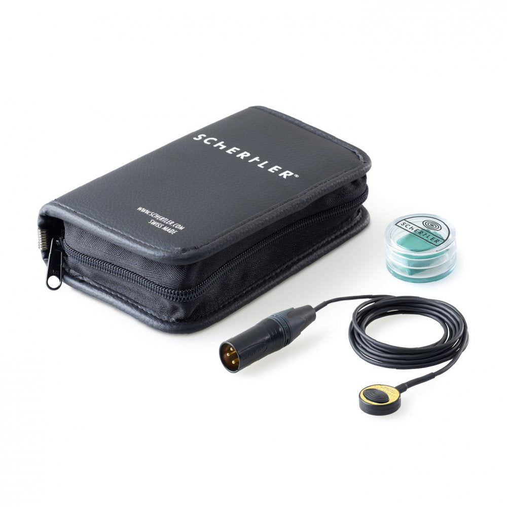Pickup device with cable and XLR-style connector, black carrying case, and small container with green pads on white background.