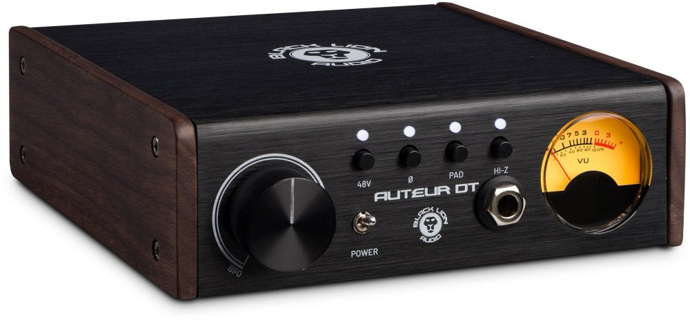 Black audio device with wood side panels, rotary knob, four buttons, toggle power switch, jack input, and a VU meter.