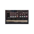 Top view of a black synthesizer KORG volca fm with keys, knobs, sliders, buttons, and display screen.