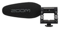 Black shotgun microphone with foam windscreen and mounting bracket showing the Zoom logo
