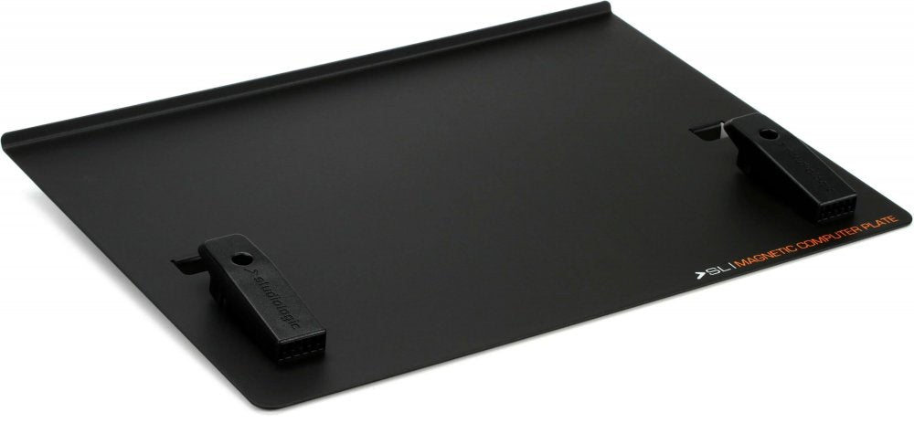 Black rectangular flat plate with two black magnetic clamps and printed text on the surface.