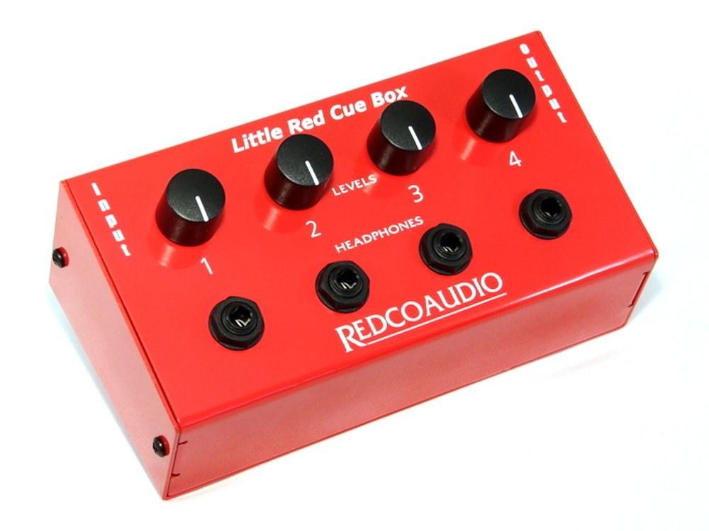 Red rectangular audio device with four black knobs and four 1/4 inch headphone jacks on top panel.