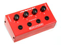 Red rectangular audio device with four black knobs and four 1/4 inch headphone jacks on top panel.