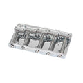 Chrome metal bridge part with five string saddles and adjustment screws for a bass guitar.