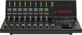 Black audio mixer or monitor controller with faders, colored level meters, a rotary knob, and red digital display.