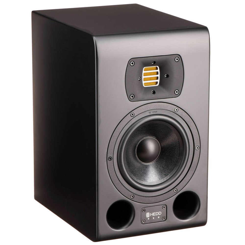 Black studio monitor speaker with a yellow tweeter, mid-range driver, and dual bass ports on the front panel.