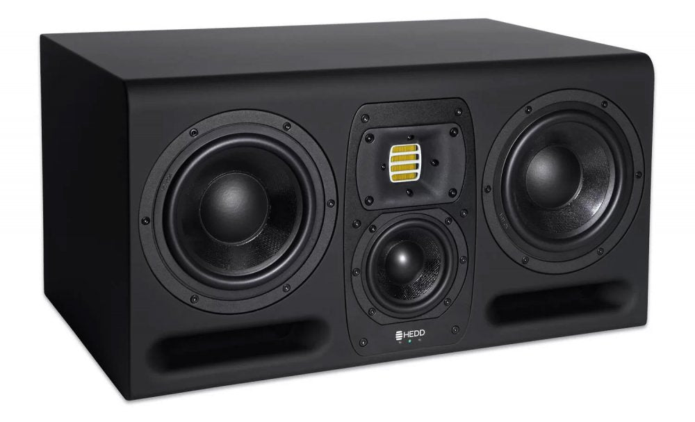 Black studio monitor speaker with two large woofers, a midrange driver, and a yellow air motion transformer tweeter