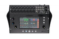 Black audio mixer with touchscreen, multiple XLR and combo input connectors, 1/4 inch outputs, USB and Ethernet ports.