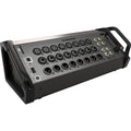 Black audio device with multiple XLR, combo jack, TRS connectors, USB and ethernet ports, and a rotary knob on angled panel.