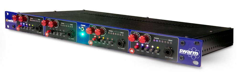 Rackmount audio equipment with multiple input channels featuring knobs, buttons, and 1/4 inch input jacks, labeled Swarm and Useful Arts.