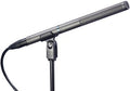 Black shotgun microphone on a stand with a cable connected via XLR connector and a rotary dial on the clip.