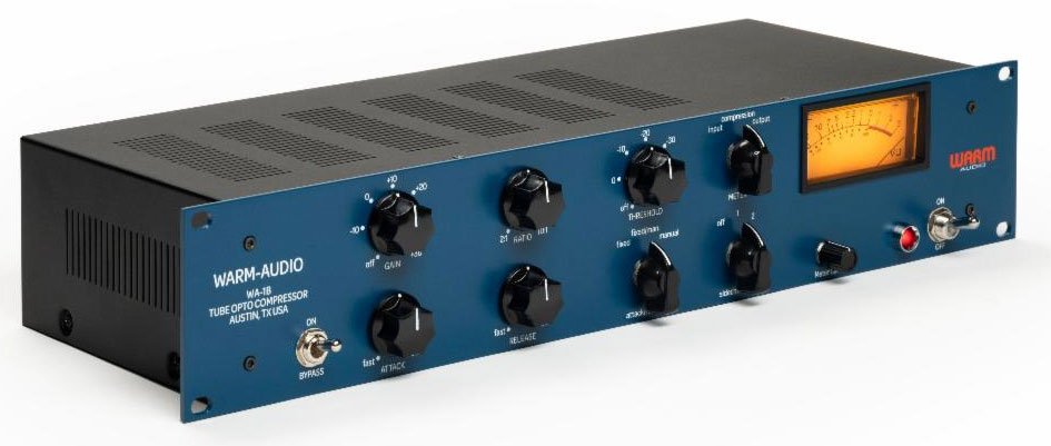 Rackmount audio compressor unit with blue front panel, multiple control knobs, switches, and an orange-lit VU meter.