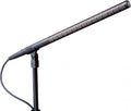 Black shotgun microphone mounted on a stand with a coiled cable attached.