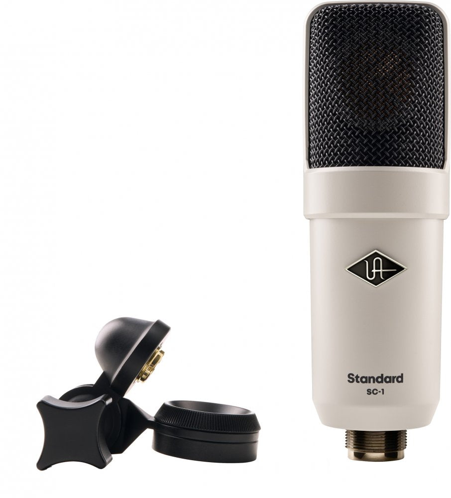 White microphone with black mesh grille labeled Standard SC-1 and a black microphone clip beside it.