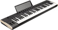 Black and beige keyboard MIDI controller with 61 keys, knobs, buttons, pitch bend and modulation wheels, and a music stand.