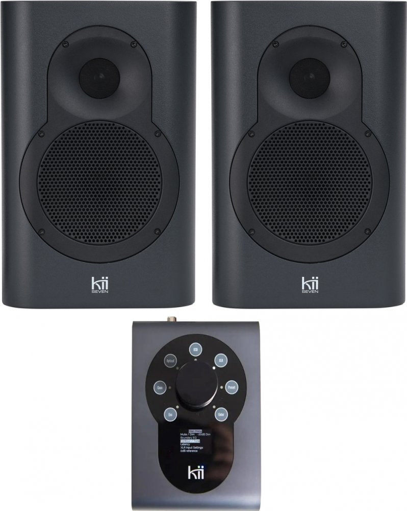Pair of dark grey studio monitors and a control unit with rotary knob and buttons shown from front