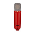 Red cylindrical microphone with a silver mesh grille and RØDE logo on the body.