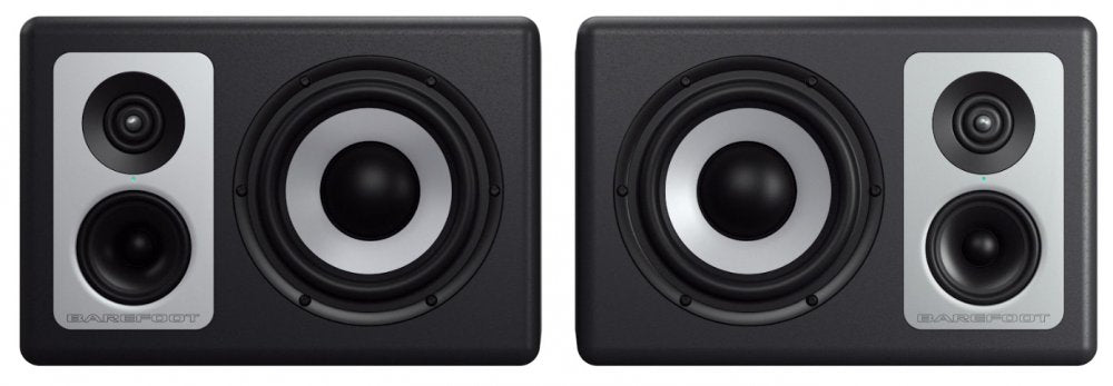 Two black and silver studio monitor speakers shown from the front with visible drivers and BAREFOOT logo.