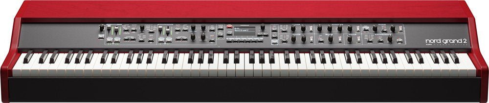 Red synthesizer keyboard with multiple knobs, buttons, sliders, and 88 keys in a clean product view.