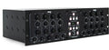 Black rackmount audio processor unit with multiple rotary knobs and push buttons labeled with frequency and gain controls.