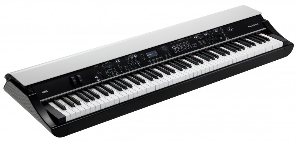 Black and white electronic keyboard synthesizer with multiple sliders, buttons, and a display screen.