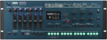 Blue KORG Opsix synthesizer module with multiple knobs, sliders, buttons, and a small display screen.