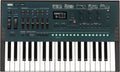 Korg Opsix mkII synthesizer keyboard with control knobs, sliders, buttons, and display screen.
