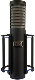 Black cylindrical microphone with protective metal mesh and shock mount, branded HUM Audio Devices.