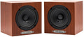 Pair of brown wood-grain cube speakers each with a single black driver and Auratone logo on front.