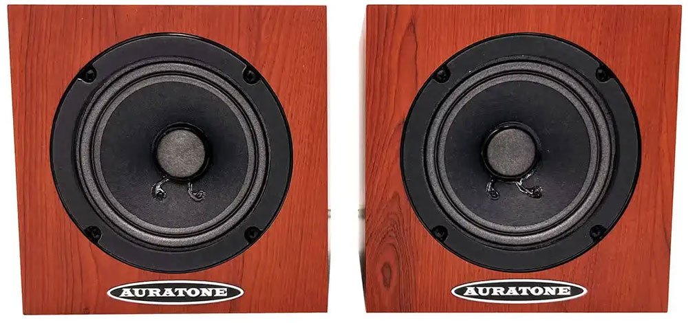 Two brown wood grain speakers with black cones and AURATONE logo on the bottom front.