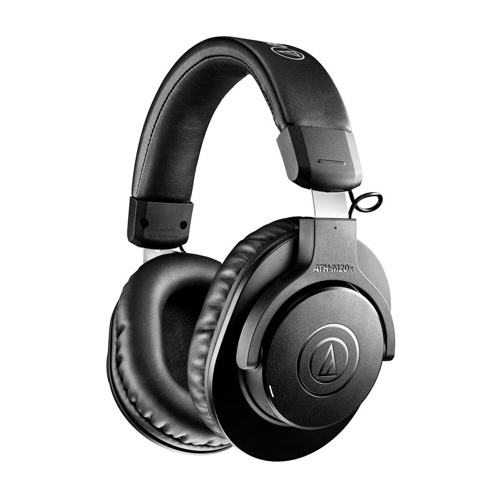 Black over-ear headphones with padded headband and ear cups, showing the ATH-M20x model marking.