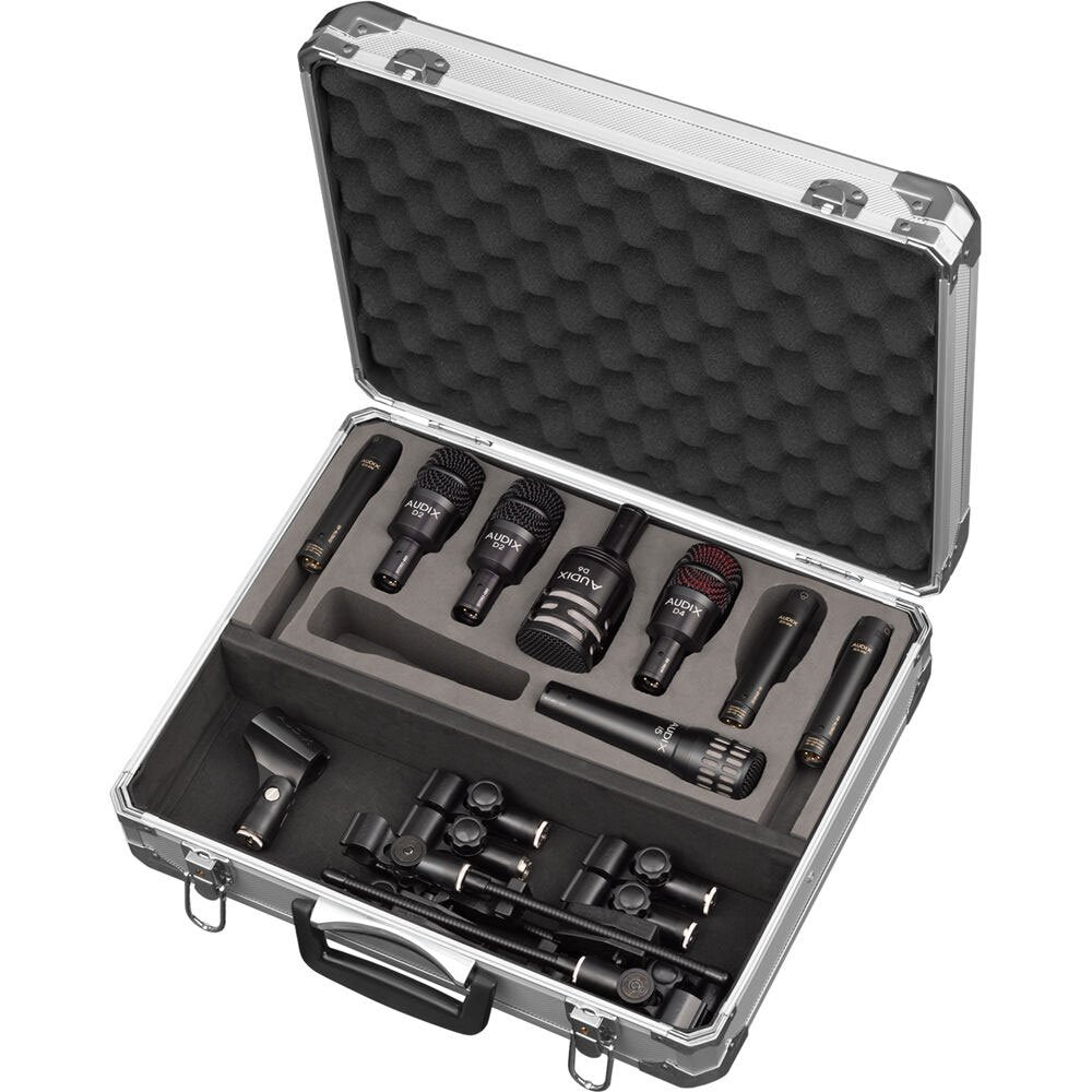 Open carrying case containing multiple Audix microphones and accessories arranged in foam.
