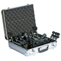 Hard case containing multiple black microphones, shock mounts, clips, and foam padding inside the lid