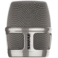 Close-up front view of a silver metal mesh microphone grille with a Shure logo on the metal band.