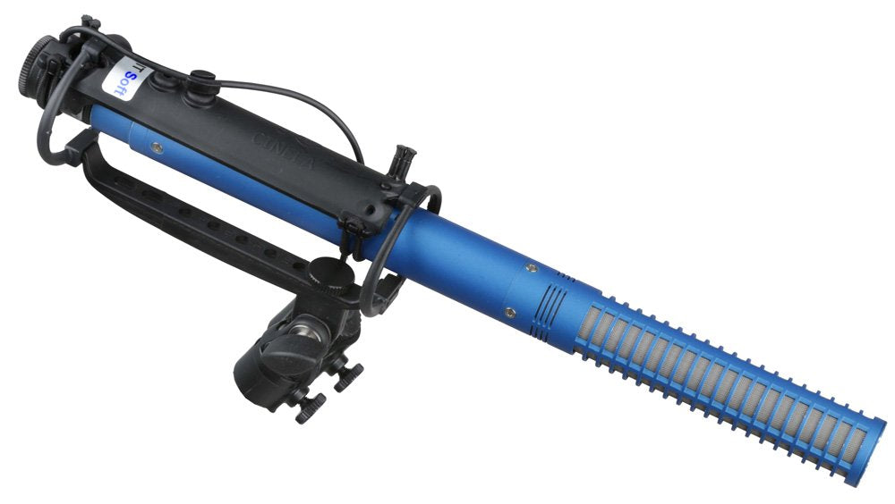 Blue shotgun microphone with black shock mount and visible knob and connector.