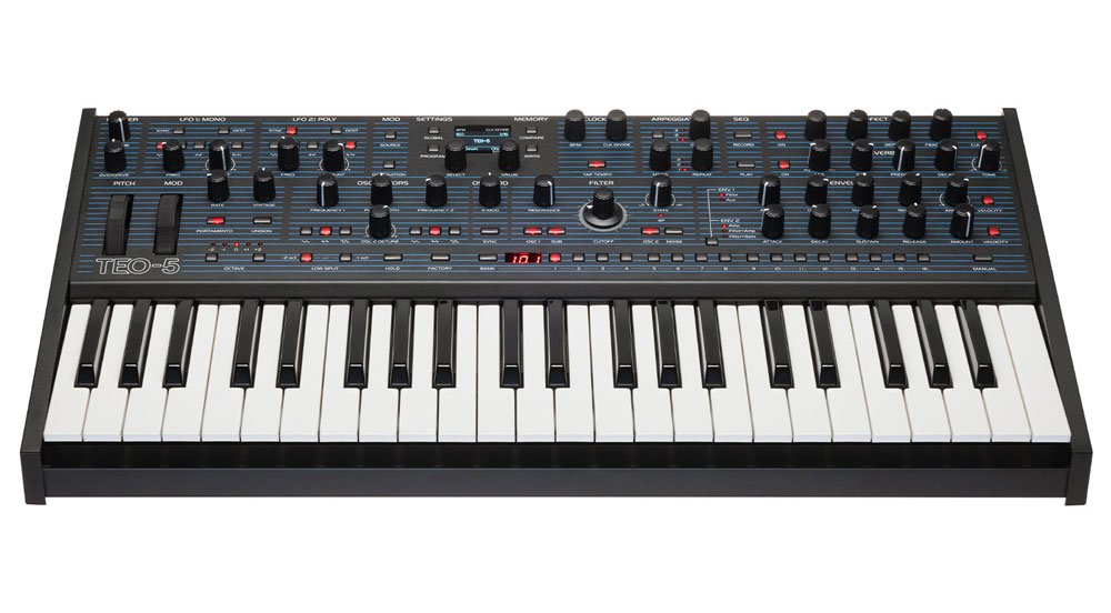 Black Oberheim TEO-5 synthesizer keyboard with multiple knobs, buttons, and a small LED display on top panel.