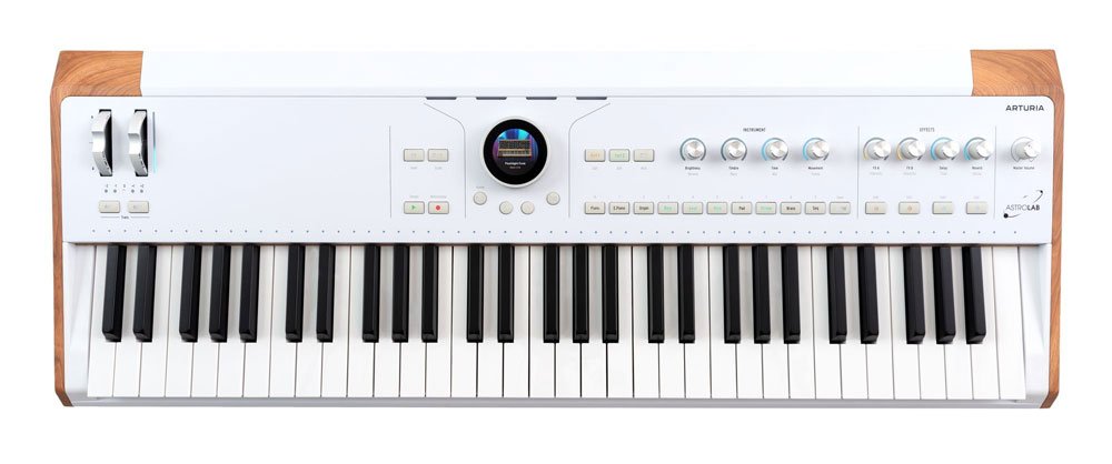 White and wood synthesizer keyboard with control knobs, buttons, and small round display above keys.