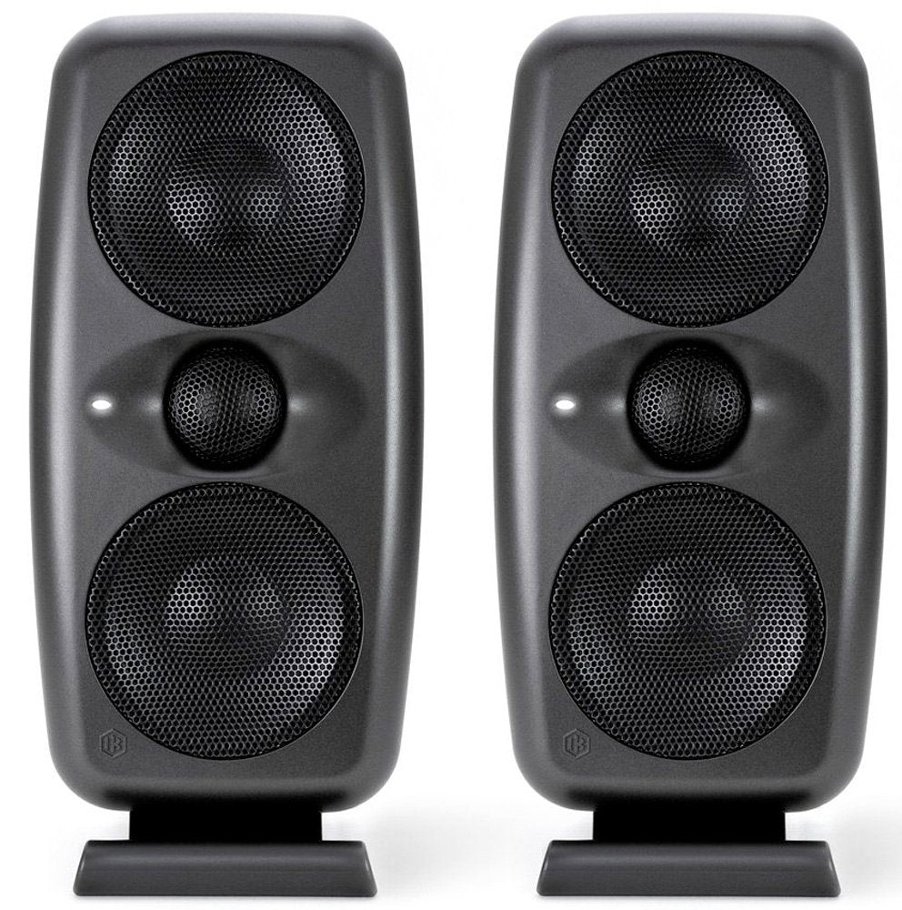 Pair of black speakers each with three visible drivers and stand, front view.