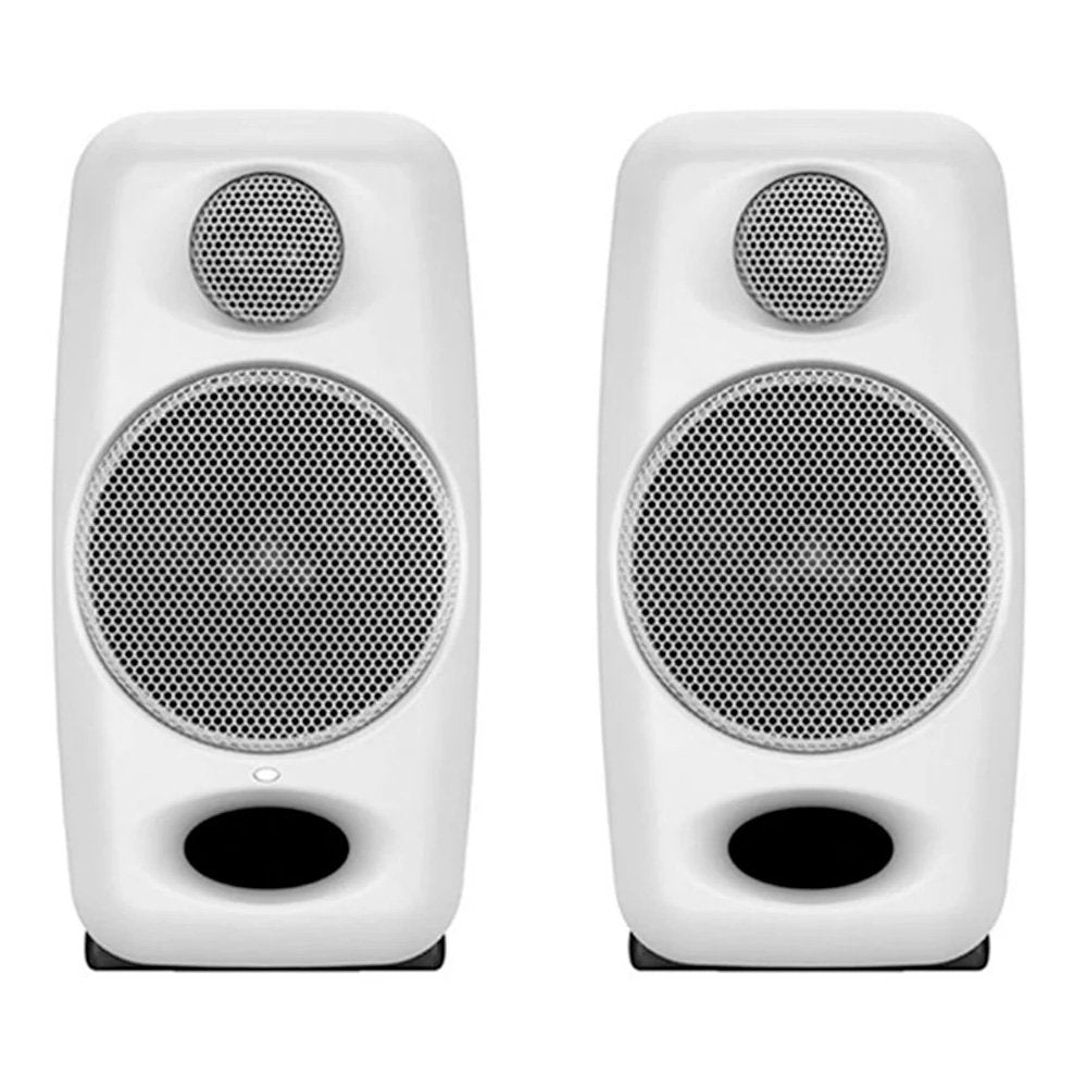 Front view of a pair of white studio monitors with metal speaker grilles and black bass ports.