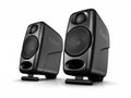Pair of black iLoud branded compact speakers shown angled with metal speaker grilles.