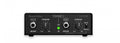 Black IK Tonex Capture device with attenuation knobs, input/output jacks, and a green clip indicator light