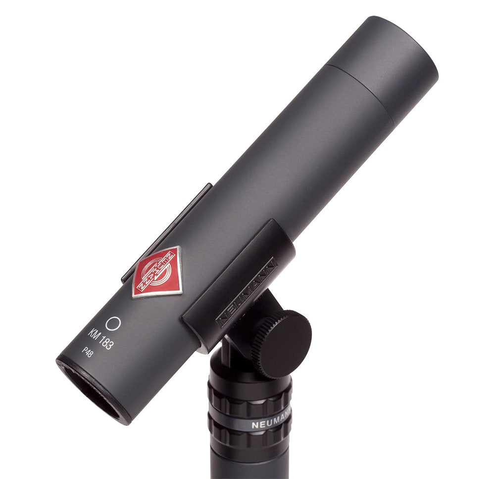 Dark gray cylindrical microphone labeled KM 183 mounted on a black adjustable stand mount with Neumann branding.