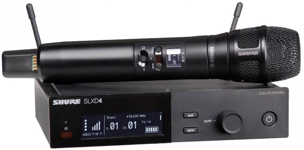 Black wireless handheld microphone resting on a black wireless receiver unit with digital display and control buttons.
